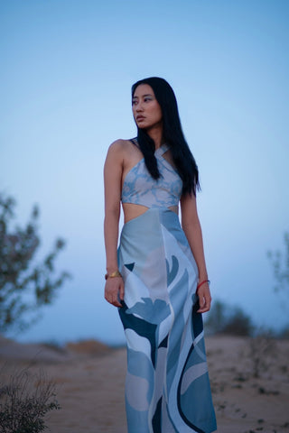 Prism blue abstract print cut out maxi dress with halter neckline and sculpted side cut design for resort vacation styling, brunch outfit, elegant summer dress for women. Designed by clos.