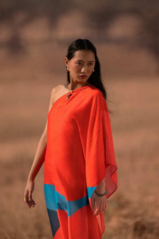 Close-up of red dress in plant-based Japanese fabric features modern prints, smooth texture, and refined drape, making it a premium choice for resort wear and occasion dressing.