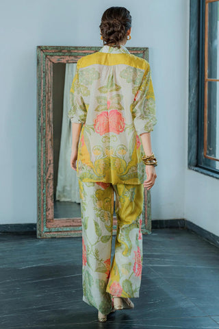Back look of lime co–ord set, tailored from pure habutai silk with a striking print. Resort wear, brunch to soiree, vacation in stlye, gen-z glam, chic and stylish women's wear.