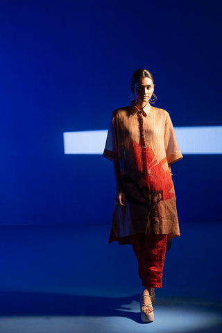 A two piece array beige & red tunic set comprises of straight cut kurta with collar and bell sleeves expressing abstract prints designed by clos.