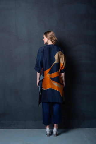 Back look of co-ord set, crafted in silk with geometric origami elements for that simple yet striking look. Perfect for formal events, resort, summer holidays, brunch, soiree, chic and stylish women's wear. 