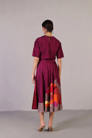 Back look of elegant dupion silk co-ord set in wine and red, styled with a half-sleeve blouse and voluminous flare skirt.