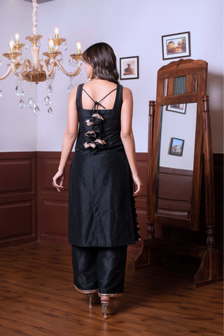 Back look of Ghazal peach silk kurta set with golden patti border pattern, women’s ethnic wear outfit in taffeta silk, perfect for festive occasions and elegant styling.
