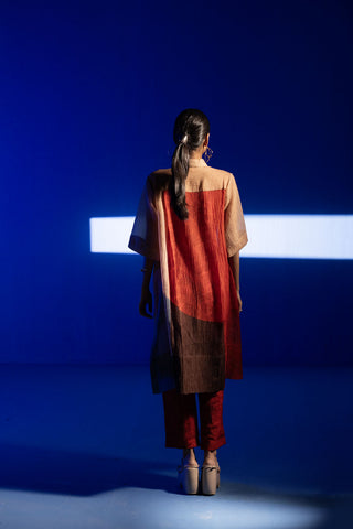 Back look of array beige & red tunic set comprises of straight cut kurta with collar and bell sleeves expressing abstract prints designed by clos.
