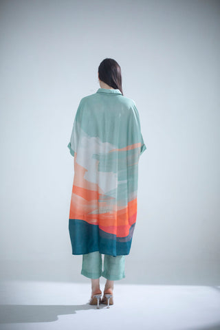 Back look of dupion silk kaftan set comprised of abstract geometric and floral print in playful color compositions and parallel pants with fusion textiles. Casual wear, resort, summer holidays, brunch, soiree, Modern ethnic tunic set for women. 