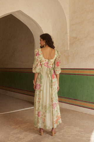 Back look of Ivory floral maxi dress crafted from soft silk organza, with a statement cutwork embroidery. All-rounder dress for Resort Ready, Maxi Moments, brunch to soiree, vacation in stlye, gen-z glam, floaty and fierce and more.