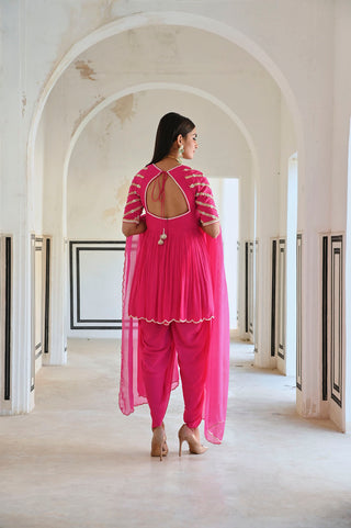Back of the Pink raglan sleeve designer Peplum with dhoti and dupatta. Festive wear for women.