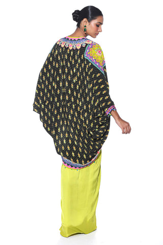 Back look of the Dark Olive and pink Hand Embroidered Shrug, Pink Printed Sleeveless Blouse, Neon Green Drape Skirt. Crepe and satin gypsy dress and bohemian fashion for cocktail parties, festive gatherings, or resort wear.