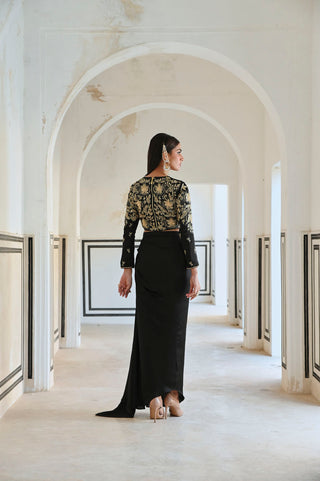 Cowl skirt and crop top dress look from the back