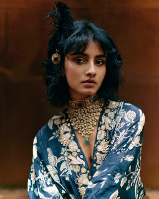 Close up look of the V neck, hand-embroidered path border and drop sleeves kaftan