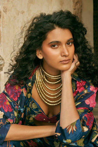 This blue floral Jacket set blouse and trouser made from Habutai Silk. Jacket is made from Organza. A close up look of crop top blouse and jacket sleeves.