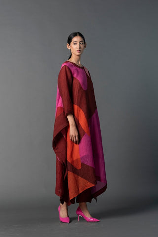 Model in Clos relaxed fit Kurta set. Perfect outfit for Brunch Afternoons, Casual Outings, Formal Events, Festive Celebration, Pooja ceremonies etc. Abstract Geometric Kurta with pant set in Japanese squash fabric with vibrant maroon pink colorblocks.