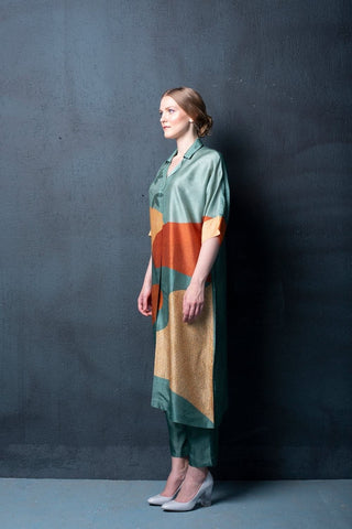 Modern asymmetric kurta in silk with abstract design paired with relaxed pants for casual chic look.