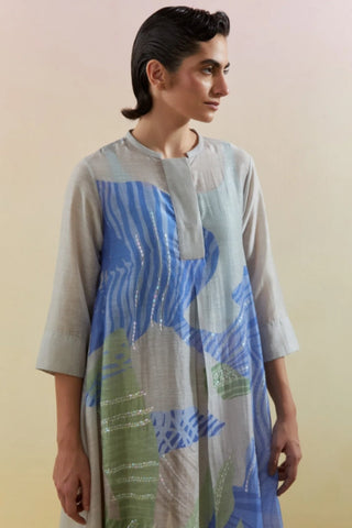 Close-up of embroidered Flow print detailing on linen silk. Premium kurta pants set for modern festive wear.
