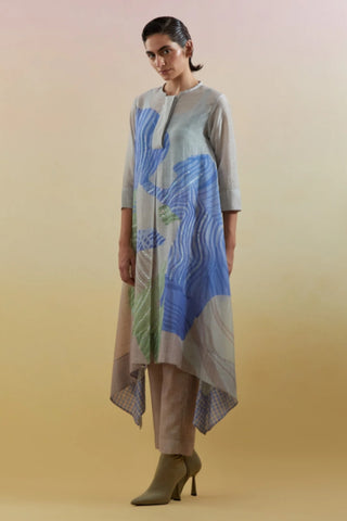 Beige and blue linen silk kurta set with asymmetrical hem and straight trousers. Beige and blue linen silk kurta set with asymmetrical hem and straight trousers. Designed by Clos.