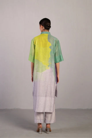 Back look of neon blue and green kurta set highlighting high-low hemline and clean silhouette, designed in-house using linen silk fabric with artistic brush-stroke prints.