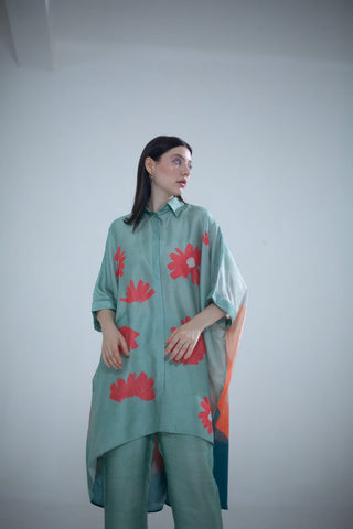 An abstract geometric and floral print Kaftan set in playful color compositions and parallel pants with fusion textiles.