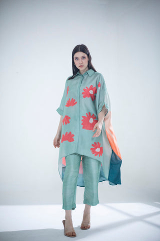 A two piece dupion silk set comprised of abstract geometric and floral print in playful color compositions and parallel pants with fusion textiles. Casual wear, resort, summer holidays, brunch, soiree, Modern ethnic tunic set for women. Designed by Clos.