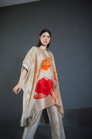 A two piece dupion silk set comprised of abstract geometric and floral print and parallel pants with fusion textiles. Designed by clos.