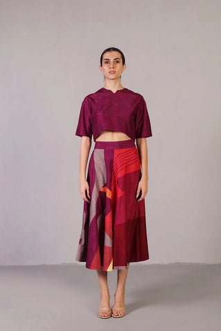 Designer co-ord set curated in rich dupion silk, showcasing a wine and red palette with half-sleeve top and flowing flare skirt. Perfect ethic fusion party, festive wear. Designed by clos.