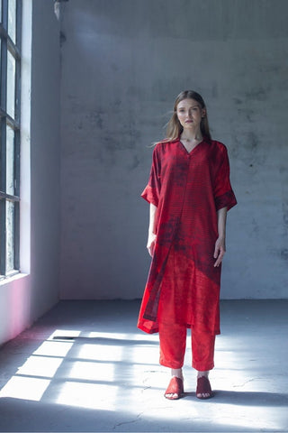 Abstract print red straight kurta with half collar paired with fusion textile parallel pants in dupion silk fabric.