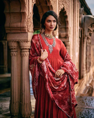 Close up look of Crimson red malai chanderi  40 kali anarkali set, with beautiful flare, paired with a skirt and a statement printed dupatta. Perfect for Sangeet Nights, Mehendi and Engagements, Business Cultural Events and festivals. Designed by Paulmi and Harsh.