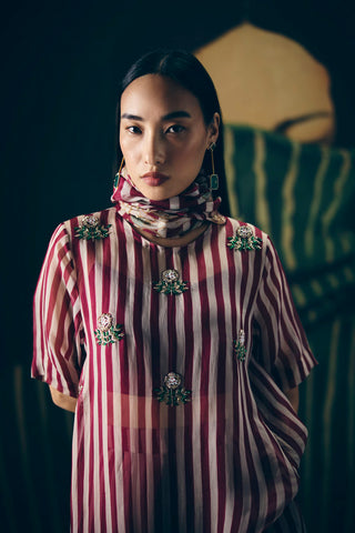Close up of maroon striped organza kurta set with embroidery, solid bustier and matching pants, fashionable Indo-western outfit ideal for festive wear and modern styling.