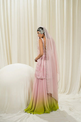 Designer baby pink peplum set featuring detailed silver embroidery, scallop hem, two-tone sharara, and embroidered dupatta with butti design.