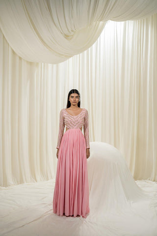 The bubble pink Anarkali Set, featuring silver jaal work embroidery in silver complemented by a cut in the back for an extra touch of elegance. The set also comes with scallop embroidered dupatta, making it perfect for any occasion. Designed by Ease.