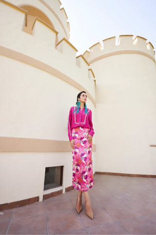 Fuschia striped shirt with floral printed Georgette skirt in vibrant white, pink and blue tones, creating a contemporary fusion outfit suitable for festive occasions and celebrations.