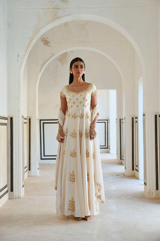 Ivory Cap Sleeve Floral Butti Embroidered 12 Kali Floor Length Anarkali with Dupatta. Designed by Ease. Perfect for Bridal Wedding ceremonies or for festive occasions.