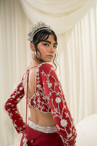 A close up look of a heavy jaal embroidered long sleeve blouse and all over butta embroidered scallop dupatta.  Designed by Ease.
