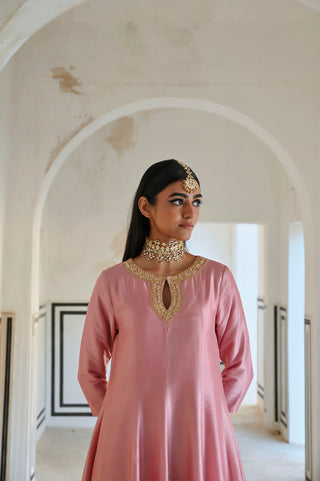 Close up of Model in Mauve Pink Neckline Embroidered Indian Designer Anarkali styled with accessories. Perfect dress for festive occasions, parties, cultural events.
