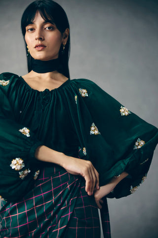 Emerald green plaid skirt with embroidered puff sleeve top, fashionable women’s ethnic ensemble, ideal for parties, weddings, and contemporary indo-western styling.