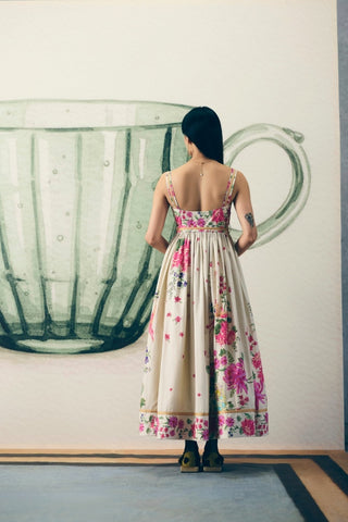 Back look of elegant Hanami Off White Maxi Dress with a graceful floral motif, tailored bodice, flowing silhouette, side zipper, and luxurious modal silk belt. A versatile designer dress ideal for casual celebrations, vacations, daytime events, and garden parties.