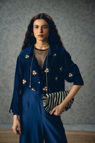 Refined navy blue set featuring a soft embroidered shirt and simple pants. A balanced blend of minimalism and elegance, perfect for creating effortless and sophisticated everyday looks.