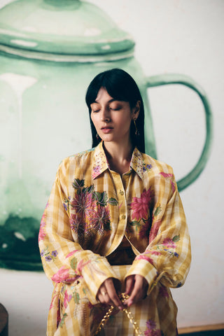 Yellow checkered printed skirt set with sheer shirt and bustier top, modern women’s co-ord outfit perfect for day events, casual wear, and contemporary fashion styling.