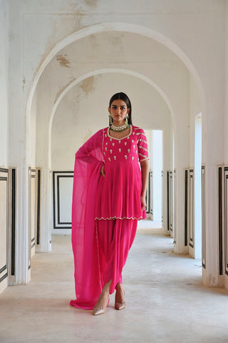 Pink raglan sleeve designer Peplum with dhoti and dupatta is a traditional festive wear for all occasions. Designed by Ease.
