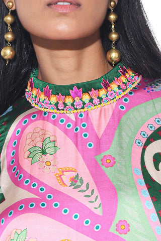 Close up look of emerald one shoulder dress perfect for elegant evenings and special occasions.