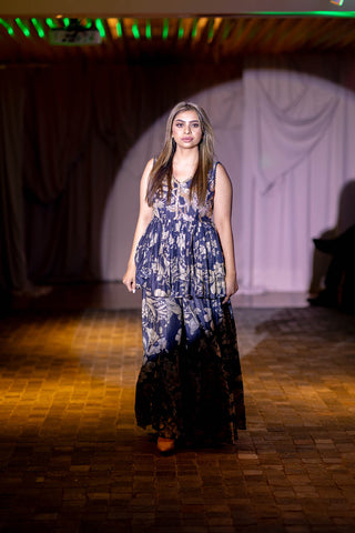 A navy blue peplum set in Paulmi and Harsh signature Roop flip bird print presented by model at fashion show in Australia.