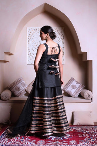 Back look of Ghazal black sharara set in cotton silk with gota patti detailing, women’s ethnic wear outfit perfect for festive occasions, weddings and traditional functions.
