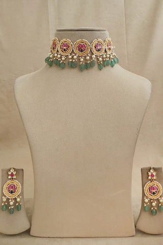 Designer necklace and earrings set in beautiful green and pink flowers with kundan work and sparkling pearls, stones, finished in gold plating with adjustable thread for weddings and parties, Premium traditional jewellery set.