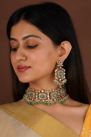 Designer necklace and earrings set with faux polki work and sparkling zircons, finished in gold plating with adjustable thread for weddings and parties, Premium traditional jewellery set.