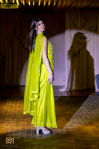 Step into the realm of Elegance with our Green Kurta ensemble, paired with Kali Sharara and Dupatta. The green hue radiates positivity and joy, while the intricate Kali Sharara design adds a touch of traditional charm. Accompanied by a flowing dupatta, this ensemble captures the spirit of femininity, comfort, and grace. Perfect for festivities, cultural events, and celebrations where elegance meets tradition.