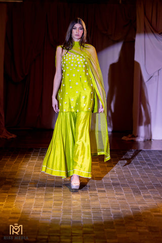 Step into the realm of Elegance with our Green Kurta ensemble, paired with Kali Sharara and Dupatta. Designed by Mona and Vishu