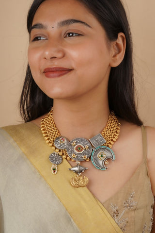 Women wearing traditional Indian jadau necklace with dual tone gold and silver finish, featuring adjustable dori fastening, perfect for weddings and cultural celebrations.