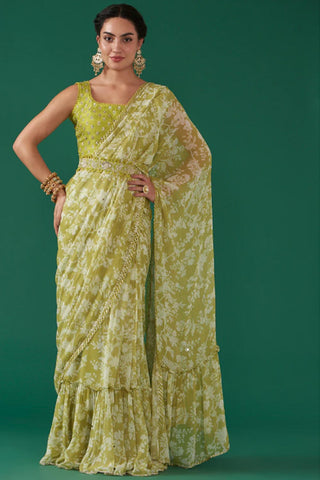Featuring a moss green digitally floral jaal printed, pre-stitched draped saree paired with a matching hand embroidered blouse in silk base and a moss green hand embroidered silk detachable waist belt. Designer - Ivory By Dipika
