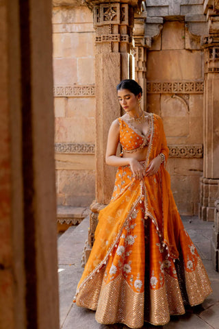 A perfect Tangerine lehenga set for bridal wedding ceremonies or Heldi fucntion. Designer - Ivory By Dipika
