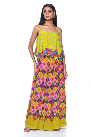 The lime yellow Royal Paisley Pattern Top showcases intricate hand embroidery, adding a touch of elegance to its vibrant design. Paired with Pleated Palazzo Pants, this ensemble blends traditional charm with modern touch.