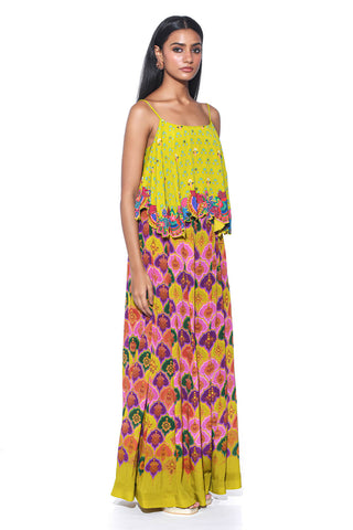 Lime yellow top showcases intricate hand embroidery, adding a touch of elegance to its vibrant design. Paired with Violet Pleated Palazzo Pants, this ensemble blends traditional charm with modern touch.